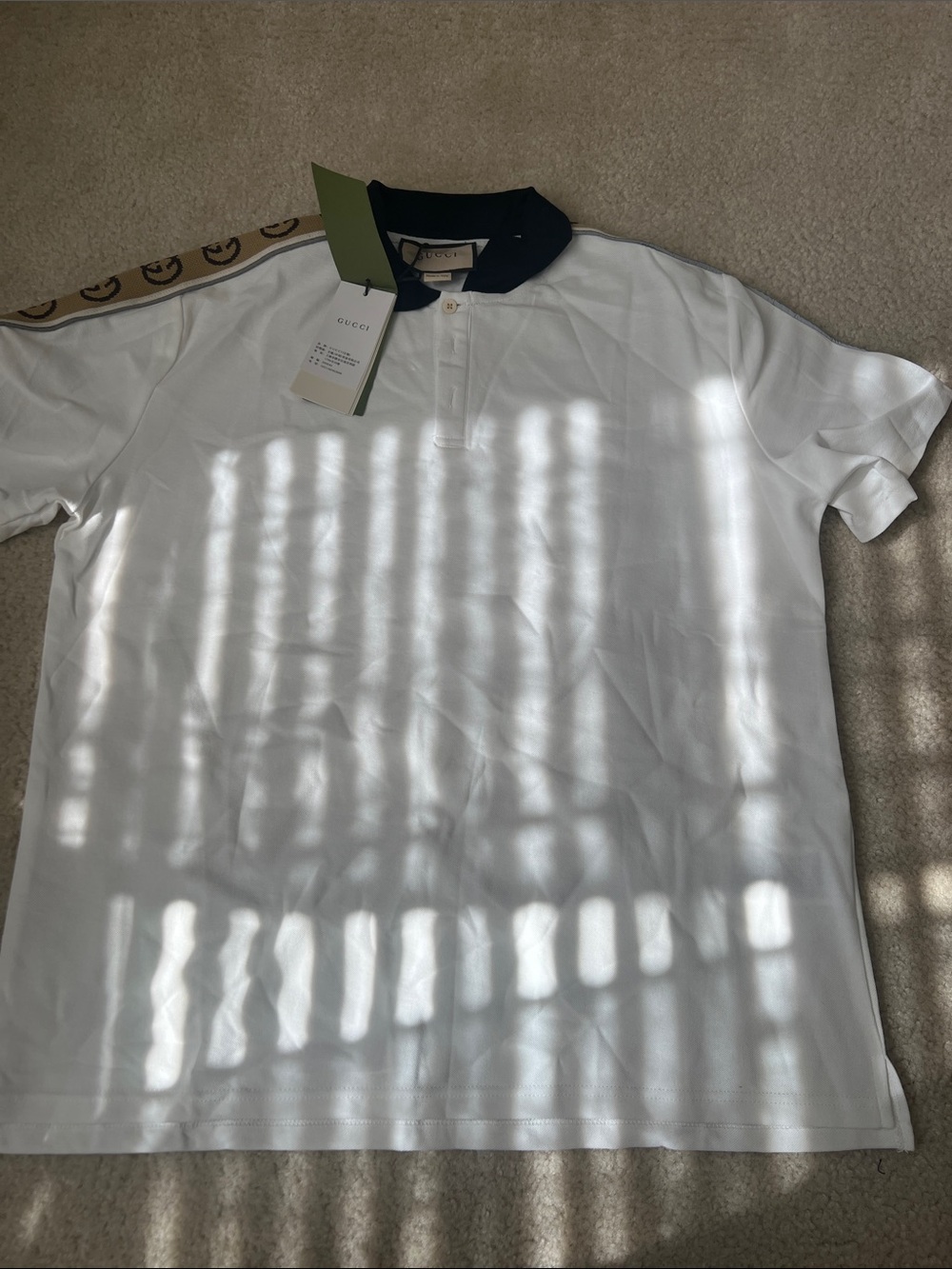 White Polo with Black Collar and Beige Logo Tape